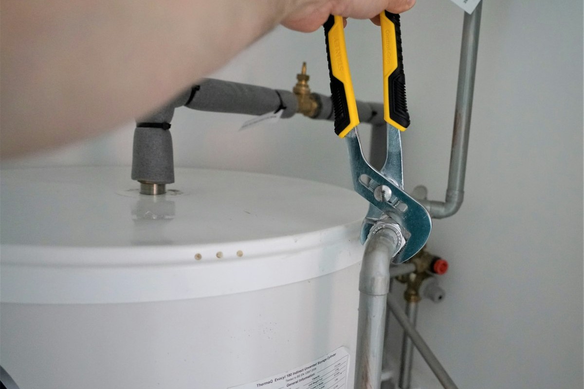 A DHS Plumbing technician diagnosing the issue on-site before the estimate was written