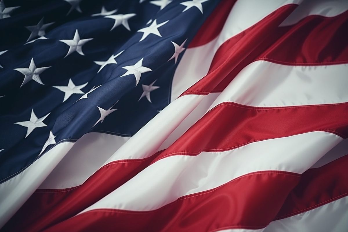 An American flag, the stripes catching low afternoon light