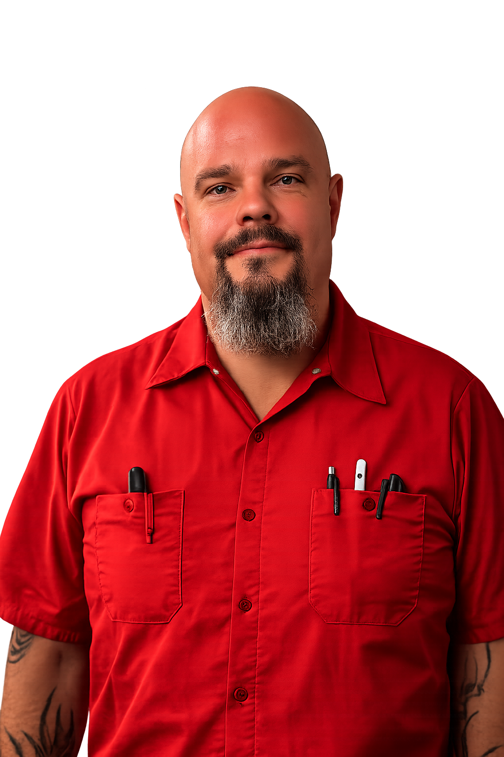 Portrait with dramatic vignette lighting of a bald man with a grey-flecked beard, wearing the red work shirt with pens in the chest pocket.